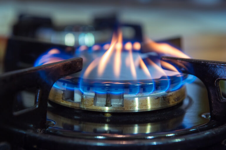 gas stove with blue with orange flames