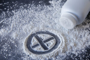spilled-talcum-powder-with-cross-sign-fingered-into-powder