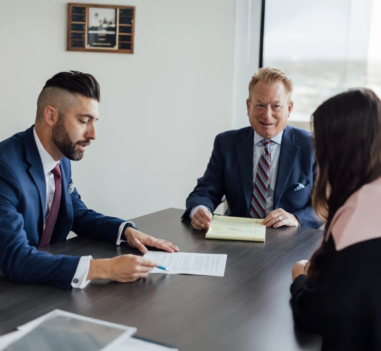 shot of Stuart Goldenberg and Noah Lauricella speaking with a client